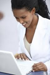 Image of Woman typing on computer